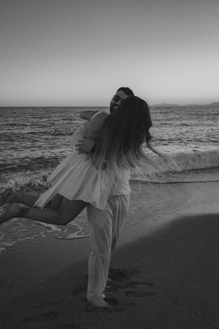 romantic embrace on antalya beach at sunset